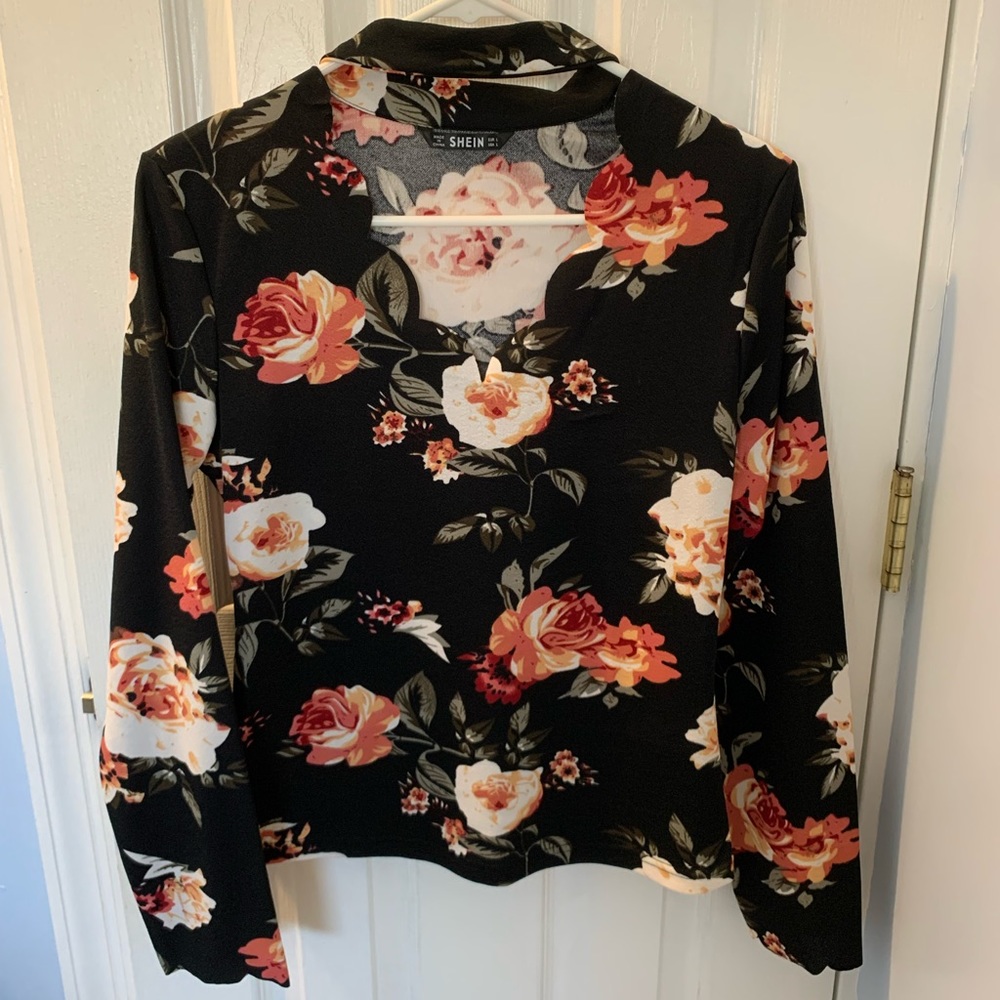 Shein top in black with floral design.